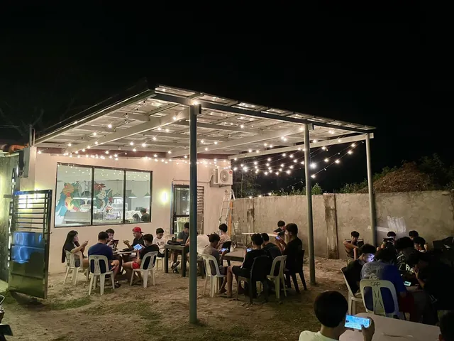 Guests at the alfresco area at night under string lights